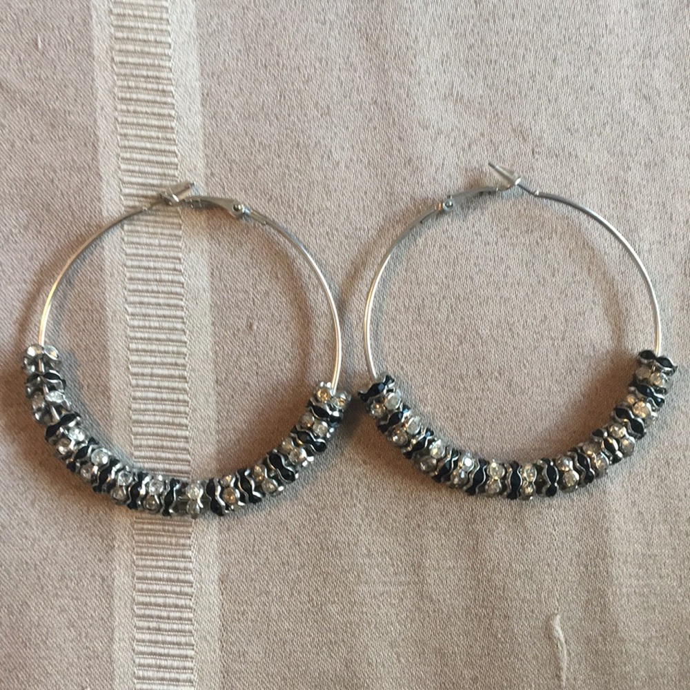 Black and silver GUESS hoop earrings